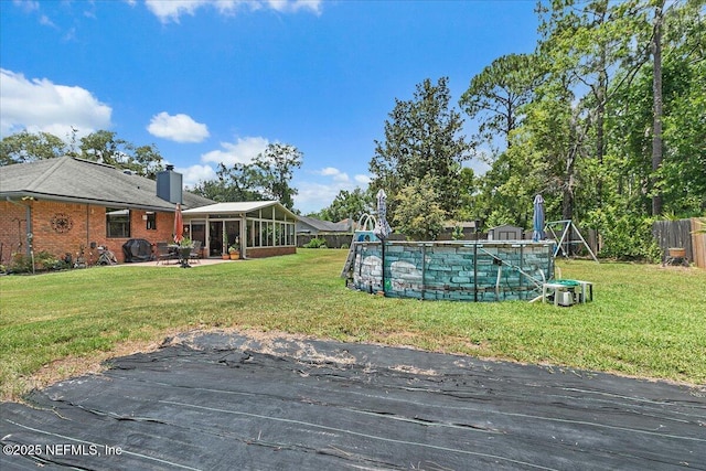 2282 Osceola Forest Ct, Fruit Cove, FL 32259 - view of yard with a sunroom, an outdoor pool, and a patio area