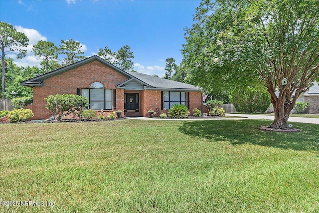2282 Osceola Forest Ct, Fruit Cove, FL 32259 - ranch-style home with brick siding and a front lawn