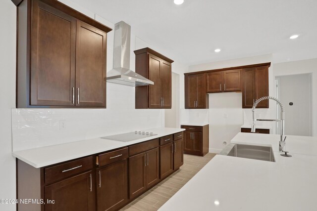 3245 Pipers Way, Green Cove Springs, FL 32043 - kitchen featuring wall chimney range hood, electric cooktop, light wood-style floors, recessed lighting, and light countertops