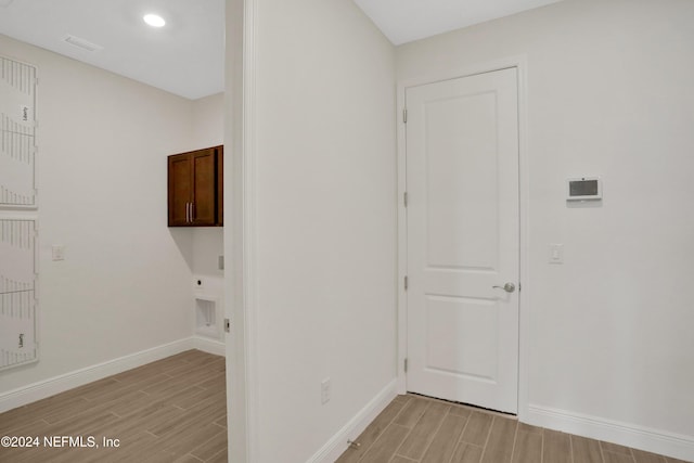 3245 Pipers Way, Green Cove Springs, FL 32043 - laundry room with wood tiled floors, cabinet space, electric dryer hookup, and recessed lighting