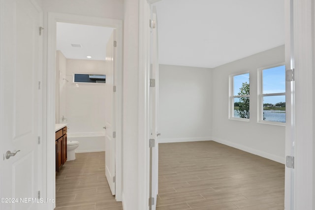 3245 Pipers Way, Green Cove Springs, FL 32043 - hallway with light wood-style floors and baseboards