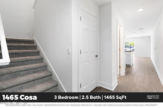 1001 Aiken St, Saint Augustine, FL 32084 - stairway featuring wood finished floors and recessed lighting