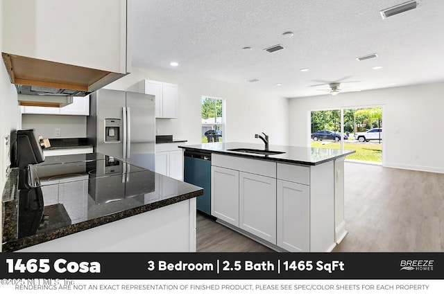 1001 Aiken St, Saint Augustine, FL 32084 - kitchen featuring dishwashing machine, stainless steel fridge with ice dispenser, wood finished floors, white cabinets, and recessed lighting