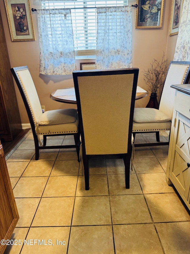 2529 W 28th St, Jacksonville, FL 32209 - dining room with light tile patterned flooring