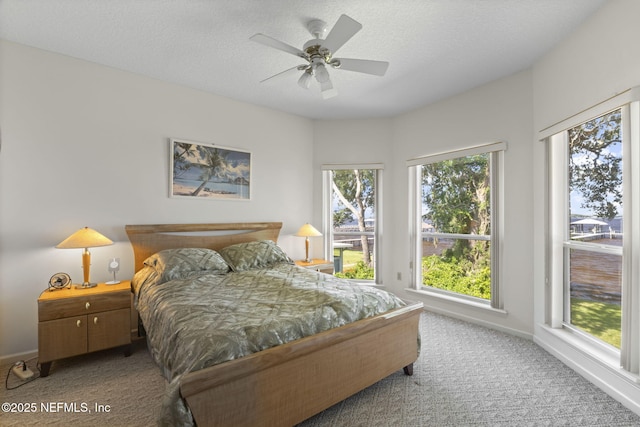 3305 US Highway 17, Fleming Island, FL 32003 - carpeted bedroom with a ceiling fan and a textured ceiling
