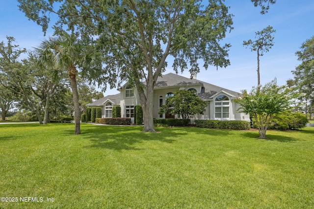 105 Teal Nest Ct, Ponte Vedra Beach, FL 32082 - view of front facade featuring a front lawn and roof with shingles