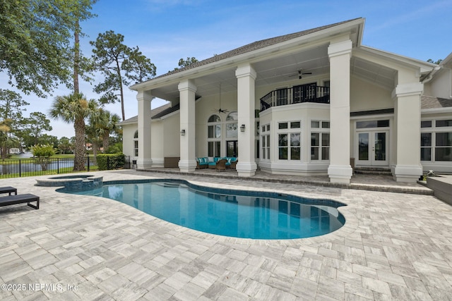 105 Teal Nest Ct, Ponte Vedra Beach, FL 32082 - view of swimming pool featuring french doors, a ceiling fan, a patio, and a pool with connected hot tub