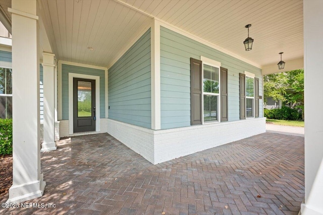 305 Seahill Dr, Saint Augustine, FL 32092 - doorway to property with a porch and brick siding