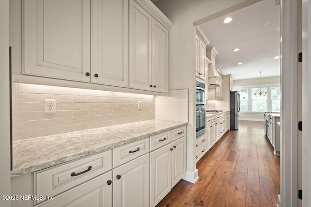 305 Seahill Dr, Saint Augustine, FL 32092 - kitchen with stainless steel appliances, dark wood-style floors, recessed lighting, and backsplash