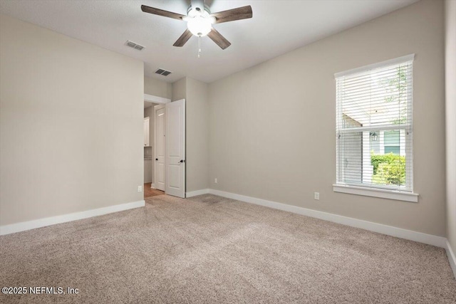 305 Seahill Dr, Saint Augustine, FL 32092 - spare room with light colored carpet and a ceiling fan