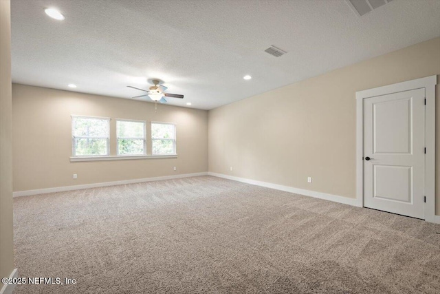 305 Seahill Dr, Saint Augustine, FL 32092 - empty room with a ceiling fan, carpet floors, recessed lighting, and a textured ceiling