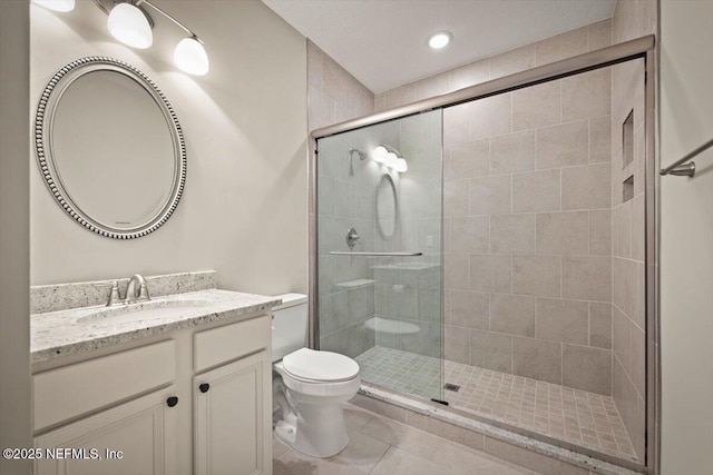 305 Seahill Dr, Saint Augustine, FL 32092 - bathroom featuring vanity, a stall shower, tile patterned floors, and recessed lighting