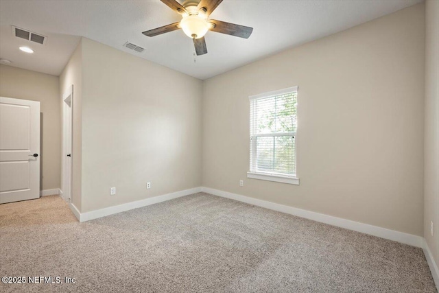305 Seahill Dr, Saint Augustine, FL 32092 - spare room featuring light carpet and ceiling fan