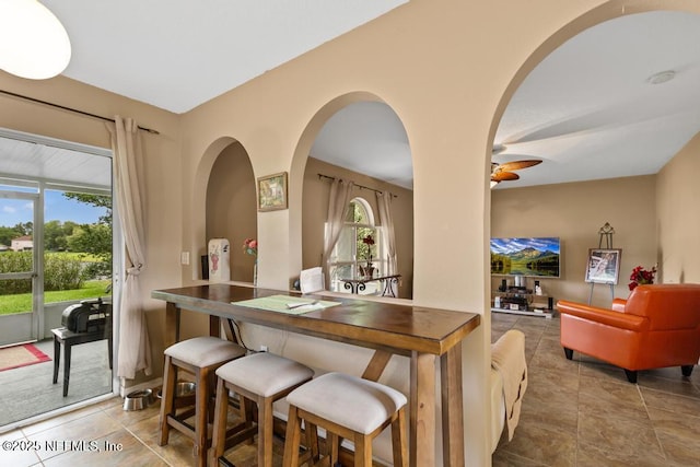 76146 Long Leaf Loop, Yulee, FL 32097 - indoor dry bar with healthy amount of natural light, tile patterned floors, a ceiling fan, and arched walkways