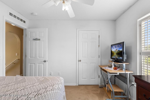 76146 Long Leaf Loop, Yulee, FL 32097 - bedroom with light colored carpet, arched walkways, and ceiling fan