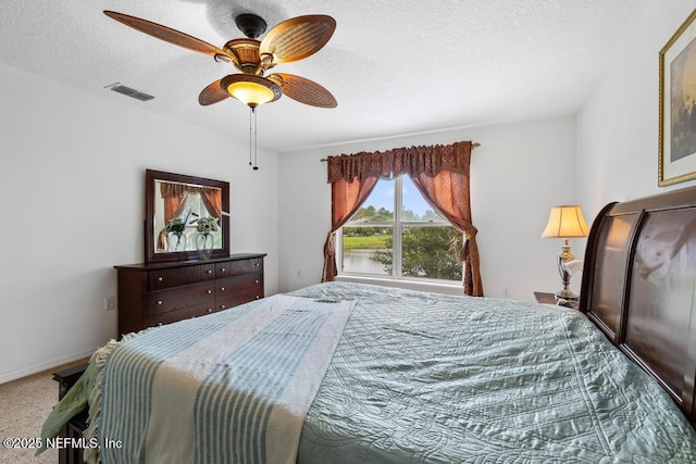 76146 Long Leaf Loop, Yulee, FL 32097 - bedroom with carpet floors, a textured ceiling, and a ceiling fan