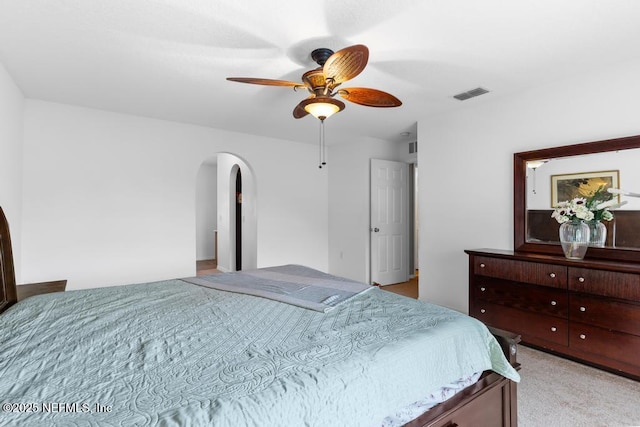 76146 Long Leaf Loop, Yulee, FL 32097 - bedroom with arched walkways, light colored carpet, and a ceiling fan