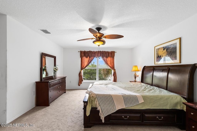 76146 Long Leaf Loop, Yulee, FL 32097 - bedroom with light colored carpet, a textured ceiling, and ceiling fan