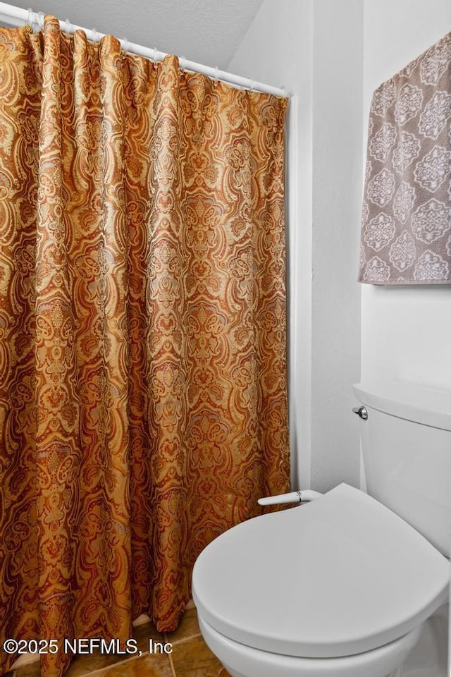 76146 Long Leaf Loop, Yulee, FL 32097 - full bathroom featuring toilet and a shower with shower curtain