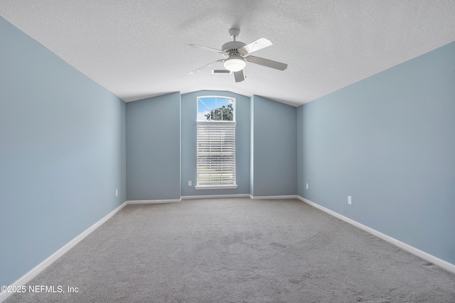 253 Bell Branch Ln, Saint Johns, FL 32259 - empty room featuring lofted ceiling, ceiling fan, a textured ceiling, and carpet