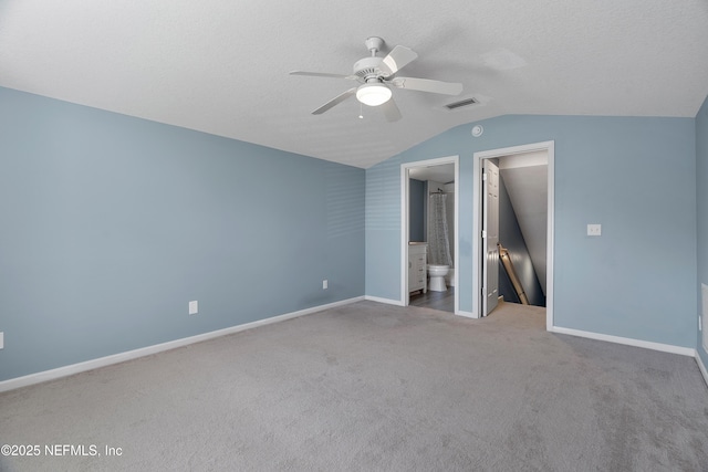 253 Bell Branch Ln, Saint Johns, FL 32259 - unfurnished bedroom with vaulted ceiling, carpet flooring, ceiling fan, and ensuite bath
