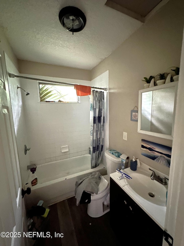 104 W 33rd St, Jacksonville, FL 32206 - bathroom featuring shower / tub combo with curtain, wood finished floors, vanity, and a textured ceiling