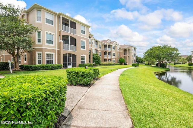 7990 Baymeadows Rd Unit 1003, Jacksonville, FL 32256 - surrounding community featuring a yard, a water view, and a residential view