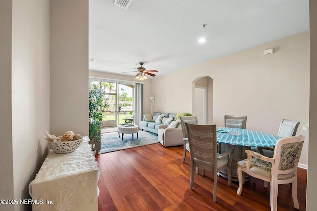 7990 Baymeadows Rd Unit 1003, Jacksonville, FL 32256 - living room with arched walkways, wood-type flooring, and a ceiling fan