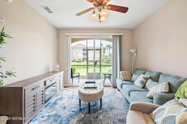 7990 Baymeadows Rd Unit 1003, Jacksonville, FL 32256 - living room with a ceiling fan and wood finished floors
