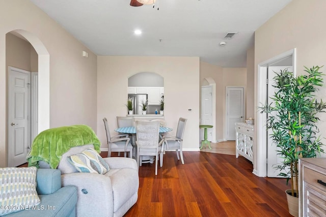 7990 Baymeadows Rd Unit 1003, Jacksonville, FL 32256 - living room with arched walkways, a ceiling fan, and dark wood-style floors