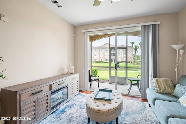 7990 Baymeadows Rd Unit 1003, Jacksonville, FL 32256 - living area with light wood-style floors and a ceiling fan