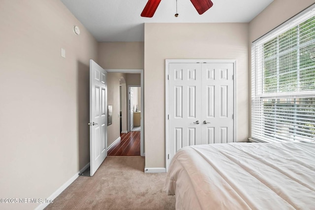 7990 Baymeadows Rd Unit 1003, Jacksonville, FL 32256 - bedroom with light carpet, a closet, and ceiling fan