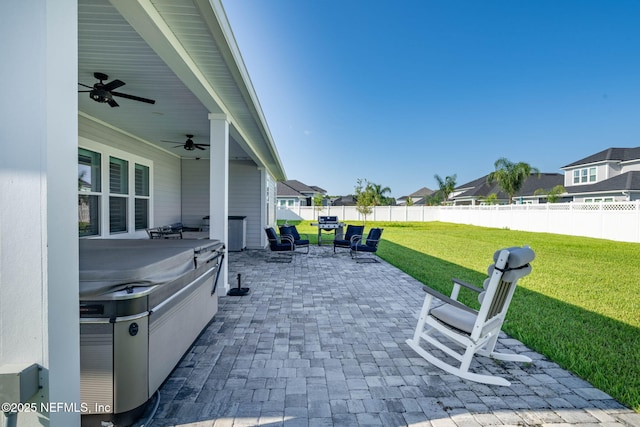 50 Tartan Ct, Saint Augustine, FL 32092 - fenced backyard featuring a hot tub, a patio area, ceiling fan, and a residential view
