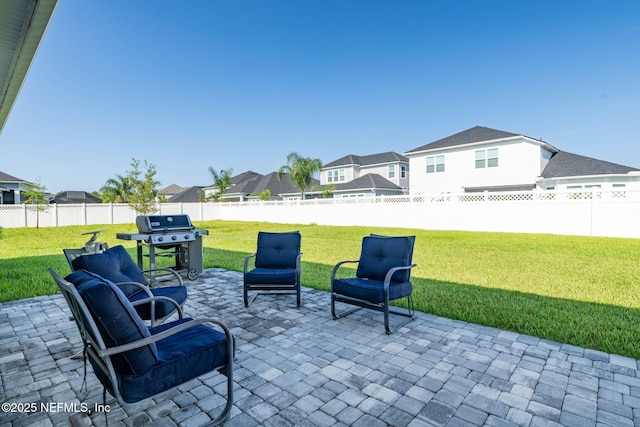 50 Tartan Ct, Saint Augustine, FL 32092 - fenced backyard featuring a patio area, a residential view, and a grill