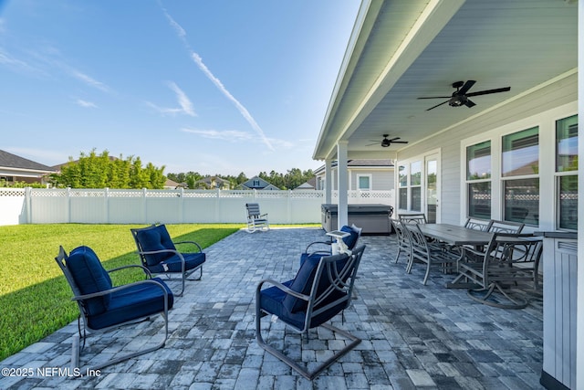 50 Tartan Ct, Saint Augustine, FL 32092 - fenced backyard with a hot tub, a patio, a ceiling fan, and outdoor dining space