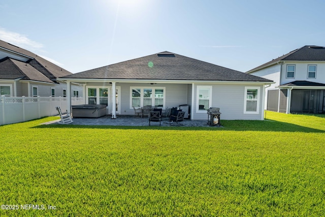 50 Tartan Ct, Saint Augustine, FL 32092 - back of property featuring a hot tub, a patio area, and a shingled roof