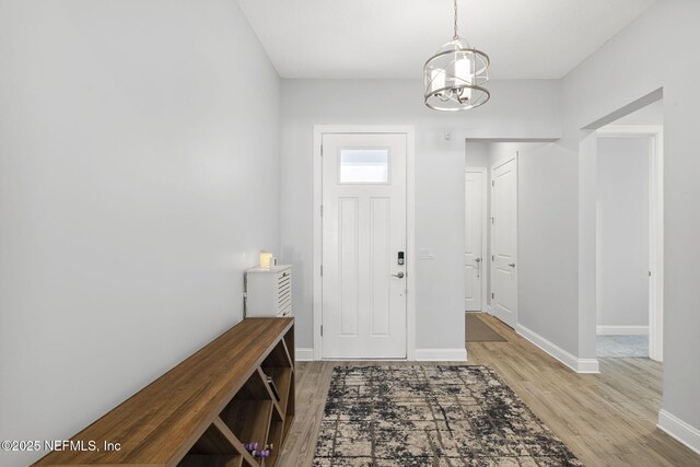 50 Tartan Ct, Saint Augustine, FL 32092 - foyer entrance with wood finished floors and a chandelier