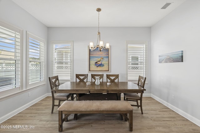 50 Tartan Ct, Saint Augustine, FL 32092 - dining area featuring a chandelier and light wood-style flooring