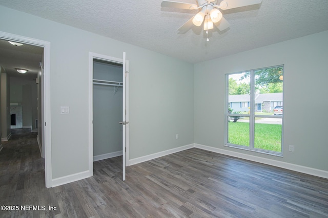 7038 Holiday Hill Ct, Jacksonville, FL 32216 - unfurnished bedroom featuring wood finished floors, a textured ceiling, a closet, and ceiling fan