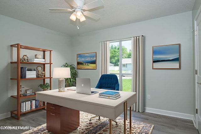 7038 Holiday Hill Ct, Jacksonville, FL 32216 - office area with wood finished floors, a ceiling fan, and a textured ceiling