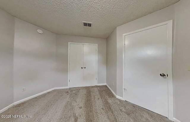 71 Naugatuck Dr, Jacksonville, FL 32225 - empty room featuring carpet flooring and a textured ceiling