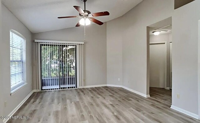 71 Naugatuck Dr, Jacksonville, FL 32225 - unfurnished room featuring lofted ceiling, wood finished floors, plenty of natural light, and ceiling fan