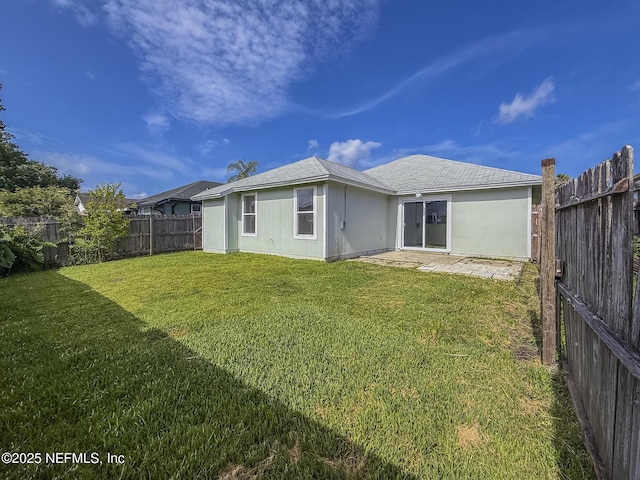 1736 Ashwood Cir, Middleburg, FL 32068 - rear view of property with a fenced backyard and roof with shingles