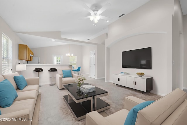 9209 Jefferson Ave, Jacksonville, FL 32208 - living area featuring a ceiling fan, light colored carpet, a chandelier, healthy amount of natural light, and lofted ceiling