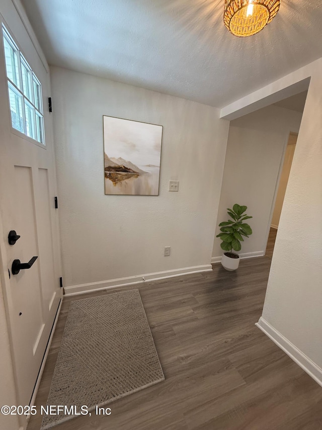 7536 Wakefield Ave, Jacksonville, FL 32208 - foyer entrance featuring wood finished floors and baseboards