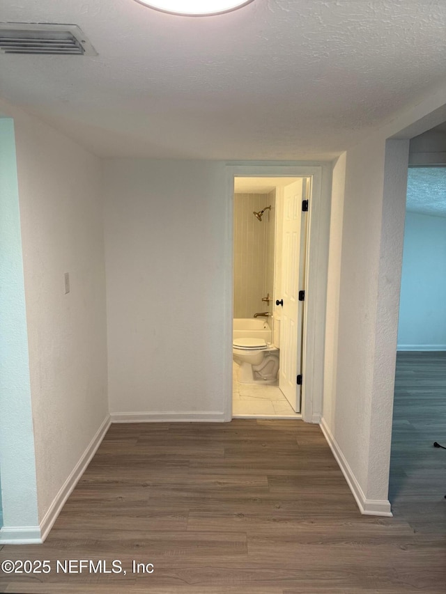 7536 Wakefield Ave, Jacksonville, FL 32208 - hall with wood finished floors and baseboards