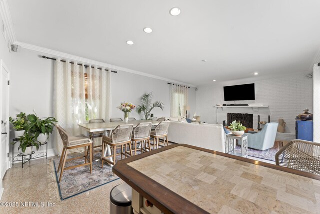 1221 Oriental Gardens Rd, Jacksonville, FL 32207 - dining room featuring crown molding, recessed lighting, and a brick fireplace