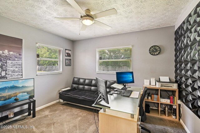 6405 Simca Dr, Jacksonville, FL 32277 - office area featuring ceiling fan, carpet, and a textured ceiling