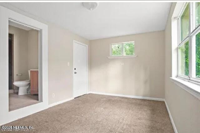 8764 3rd Ave, Jacksonville, FL 32208 - carpeted spare room featuring baseboards
