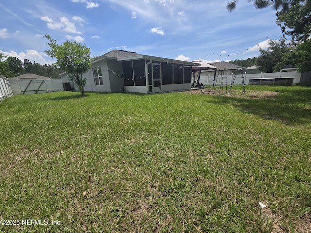 3472 Steelgate Ct, Middleburg, FL 32068 - rear view of house with a sunroom and a fenced backyard